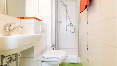 Ein Badezimmer in der Unterkunft Haus Belle-Vue