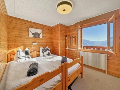 Ein Bett oder Betten in einem Zimmer der Unterkunft Mirador Alpine Horizon -Crans Montana- Swiss Alps