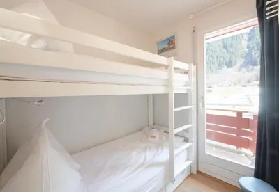 Ein Bett oder Betten in einem Zimmer der Unterkunft Eiger Residence