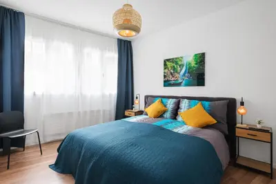 Ein Bett oder Betten in einem Zimmer der Unterkunft Spirit Apartments - Zentral am See - Parkplatz
