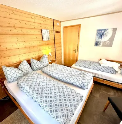 Ein Bett oder Betten in einem Zimmer der Unterkunft Apartments Chalet Tatyana