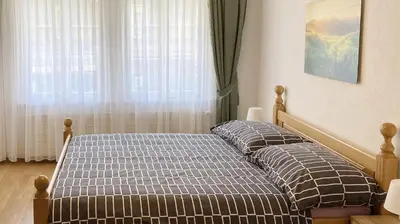Ein Bett oder Betten in einem Zimmer der Unterkunft Holiday Apartments Falke