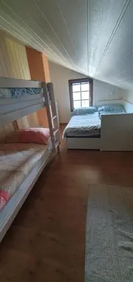 Ein Bett oder Betten in einem Zimmer der Unterkunft Gîte de Mase sur la rive droite du Val d'Hérens