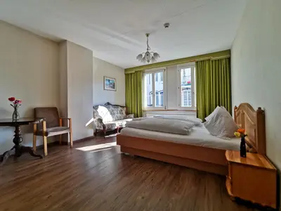Ein Bett oder Betten in einem Zimmer der Unterkunft Interlaken Apartment 25
