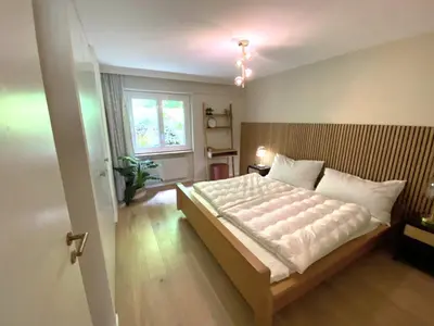 Ein Bett oder Betten in einem Zimmer der Unterkunft Lärchenwald 1703