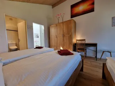Ein Bett oder Betten in einem Zimmer der Unterkunft Seeparadiesli am schönen Thunersee