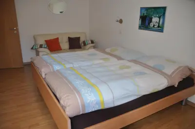 Ein Bett oder Betten in einem Zimmer der Unterkunft Apartmenthaus Holiday