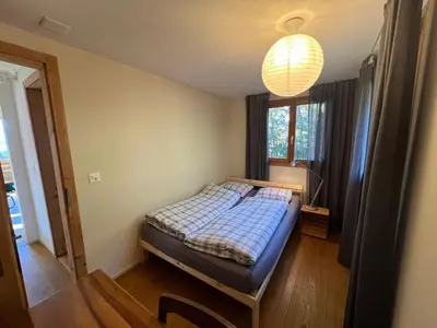 Ein Bett oder Betten in einem Zimmer der Unterkunft Chalet Friesli Beatenberg