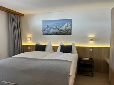 Ein Bett oder Betten in einem Zimmer der Unterkunft Modernes Studio Zermatt