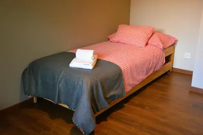 Ein Bett oder Betten in einem Zimmer der Unterkunft Mayers Swiss House, private home for 2-6 guests