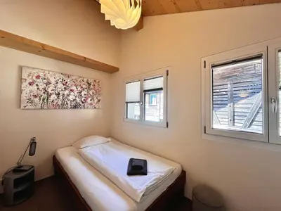 Ein Bett oder Betten in einem Zimmer der Unterkunft beim Brunnen