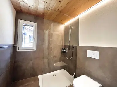 Ein Badezimmer in der Unterkunft beim Brunnen