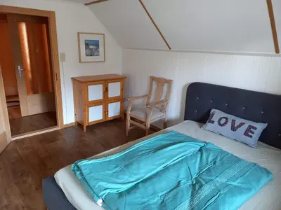 Ein Bett oder Betten in einem Zimmer der Unterkunft Chalet Bärenhaus