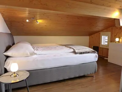 Ein Bett oder Betten in einem Zimmer der Unterkunft Apartment Brienz Sunset by Interhome
