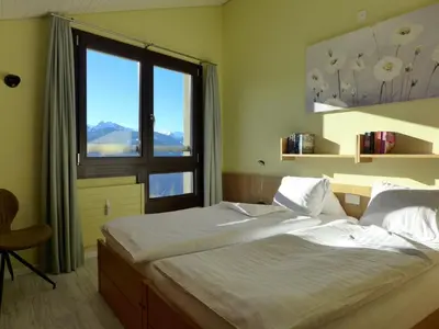 Ein Bett oder Betten in einem Zimmer der Unterkunft Apartment Enzian 720 by Interhome