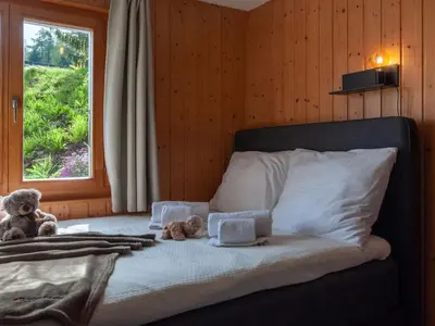 Ein Bett oder Betten in einem Zimmer der Unterkunft Chalet Dolce Cabane by Interhome