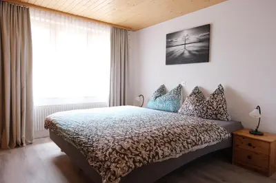 Ein Bett oder Betten in einem Zimmer der Unterkunft Hubertus 112