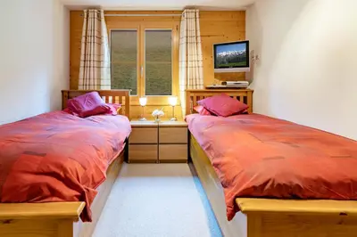 Ein Bett oder Betten in einem Zimmer der Unterkunft Chalet Bergrose 4
