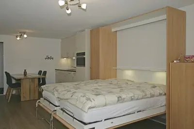 Ein Bett oder Betten in einem Zimmer der Unterkunft Adler 76