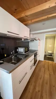 Küche/Küchenzeile in der Unterkunft Esencial Apartment Interlaken