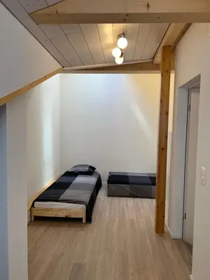 Ein Bett oder Betten in einem Zimmer der Unterkunft Esencial Apartment Interlaken