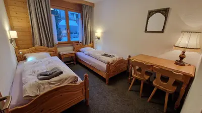 Ein Bett oder Betten in einem Zimmer der Unterkunft Alpenhof
