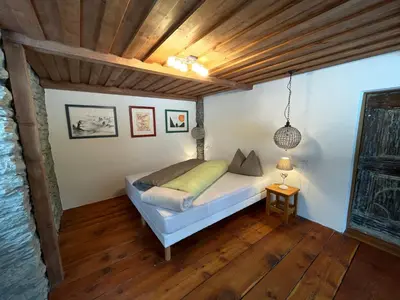Ein Bett oder Betten in einem Zimmer der Unterkunft Stegmatte - Unique luxury triplex apartment for 10 persons