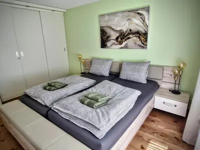 Ein Bett oder Betten in einem Zimmer der Unterkunft Ferienwohnung Valere B - it's magic gmbh