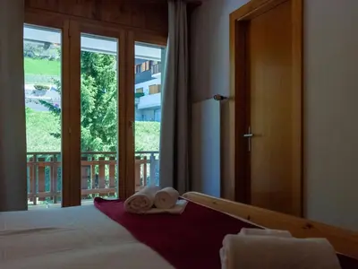 Ein Bett oder Betten in einem Zimmer der Unterkunft Apartment Les Crêtes 1-4 by Interhome