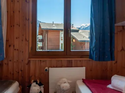 Ein Bett oder Betten in einem Zimmer der Unterkunft Apartment Les Crêtes 1-4 by Interhome