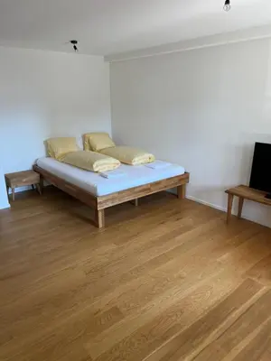 Ein Bett oder Betten in einem Zimmer der Unterkunft STUDIO JOHN Interlaken