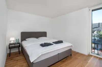 Ein Bett oder Betten in einem Zimmer der Unterkunft Moderne Neubauwohnung in Wilderswil