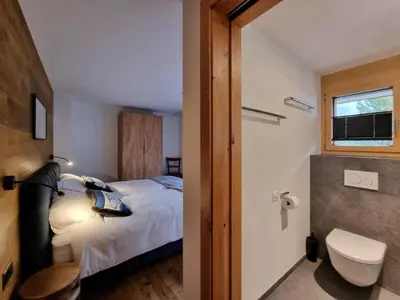 Ein Bett oder Betten in einem Zimmer der Unterkunft Gletschergarten