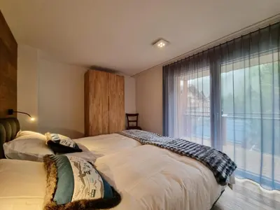 Ein Bett oder Betten in einem Zimmer der Unterkunft Gletschergarten