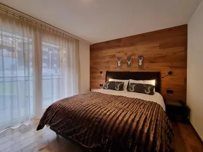 Ein Bett oder Betten in einem Zimmer der Unterkunft Gletschergarten