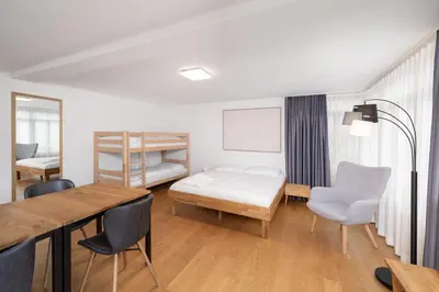 Ein Bett oder Betten in einem Zimmer der Unterkunft Studio ALBERT Interlaken