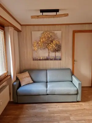 Ein Sitzbereich in der Unterkunft Gemütliche Ferienwohnung zwischen See und Bergen