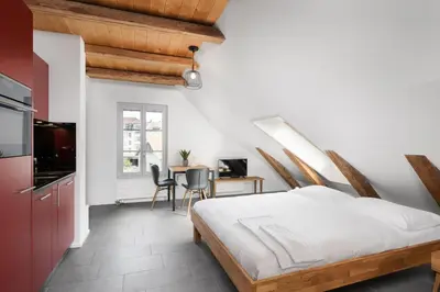 Ein Bett oder Betten in einem Zimmer der Unterkunft Studio SARA Interlaken