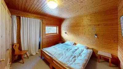 Ein Bett oder Betten in einem Zimmer der Unterkunft Ferienhaus Rehbock RB0