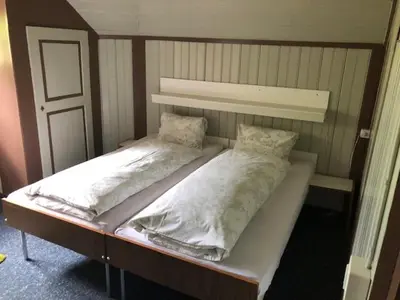 Ein Bett oder Betten in einem Zimmer der Unterkunft Hotel Bären Lodge