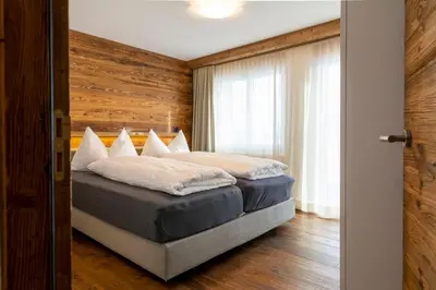Ein Bett oder Betten in einem Zimmer der Unterkunft Chalet Weisshorn 1