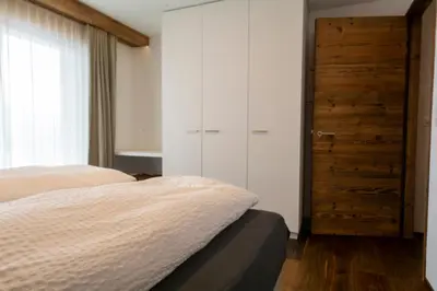 Ein Bett oder Betten in einem Zimmer der Unterkunft Chalet Weisshorn 1