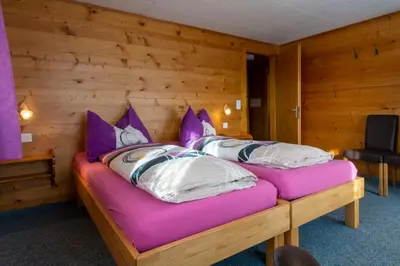 Ein Bett oder Betten in einem Zimmer der Unterkunft Chalet Weisshorn 2