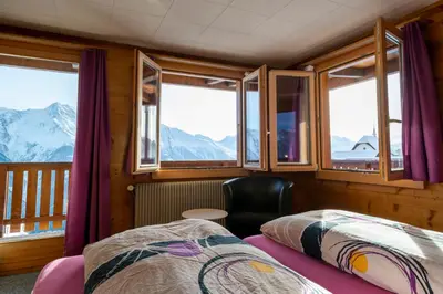 Ein Bett oder Betten in einem Zimmer der Unterkunft Chalet Weisshorn 2