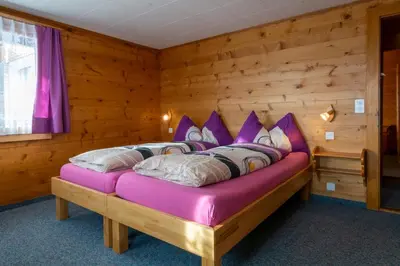 Ein Bett oder Betten in einem Zimmer der Unterkunft Chalet Weisshorn 2