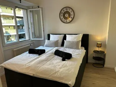 Ein Bett oder Betten in einem Zimmer der Unterkunft Sion Central Station proche toutes commodites