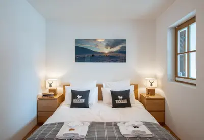 Ein Bett oder Betten in einem Zimmer der Unterkunft Chalet Alpina