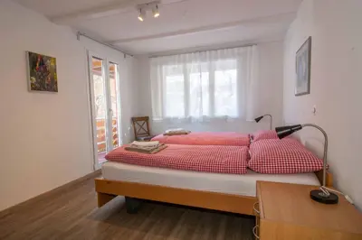 Ein Bett oder Betten in einem Zimmer der Unterkunft Chalet Azeno EG