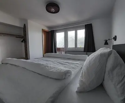 Ein Bett oder Betten in einem Zimmer der Unterkunft Berghotel Weisshorn