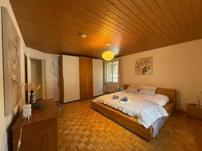 Ein Bett oder Betten in einem Zimmer der Unterkunft Chalet Maithili Lauterbrunnen -152-Year-Old Majestic Chalet